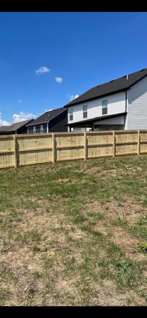 Privacy Wood Fence Installation by TM Exterior Solutions